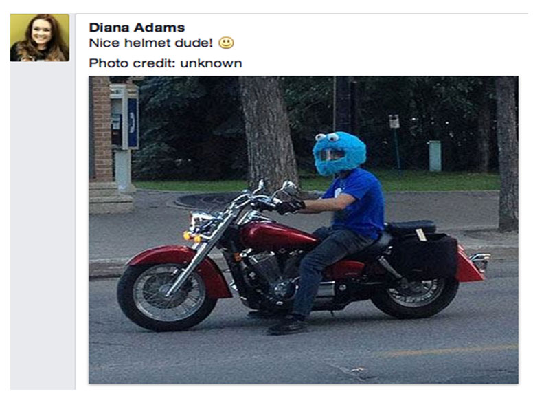 Motorcyle driver with Cookie Monster Helmet