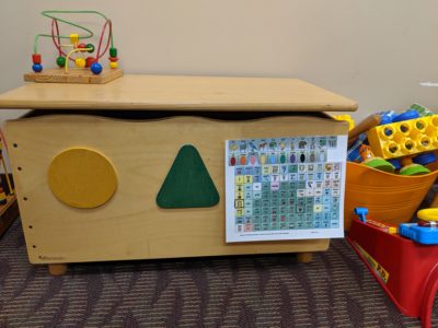Photo of a child's bench and communication board